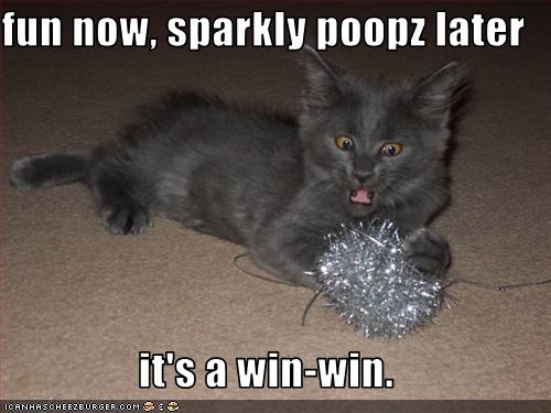 Funny pictures cat plays with tinsel