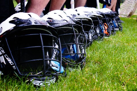 Lacrosse helmets lined up
