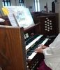 Large playing the organ