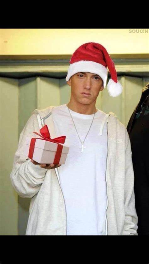 Eminem with santa hat and present   